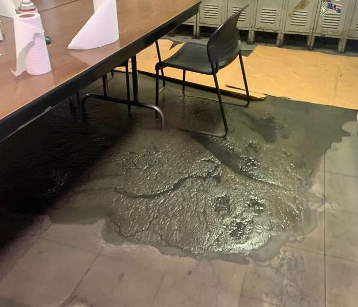 Standing sewage on break room floor before mitigation was started 