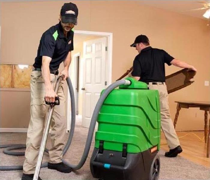 SERVPRO technician cleaning carpets
